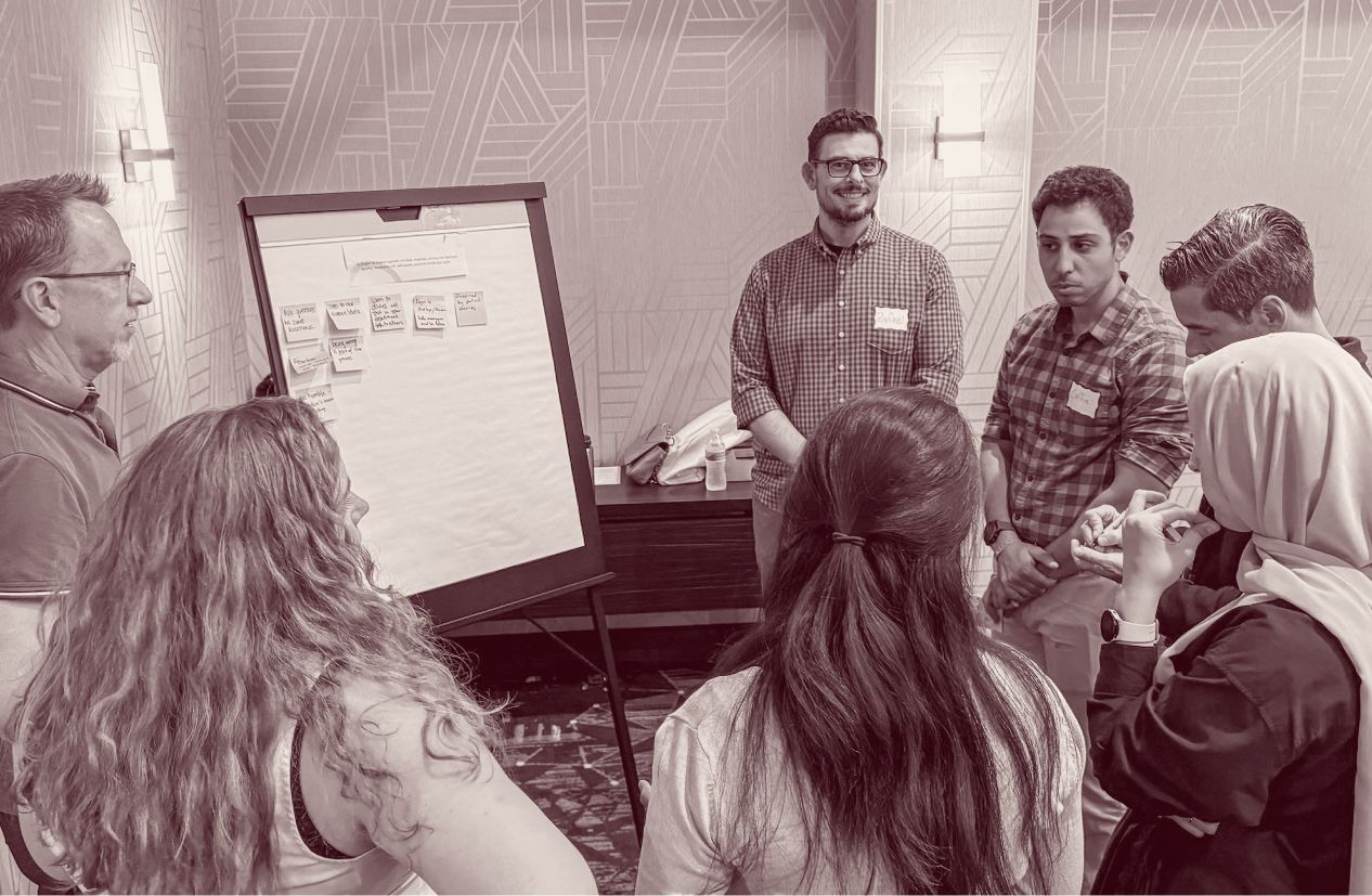 Focus group discussing in front of whiteboard